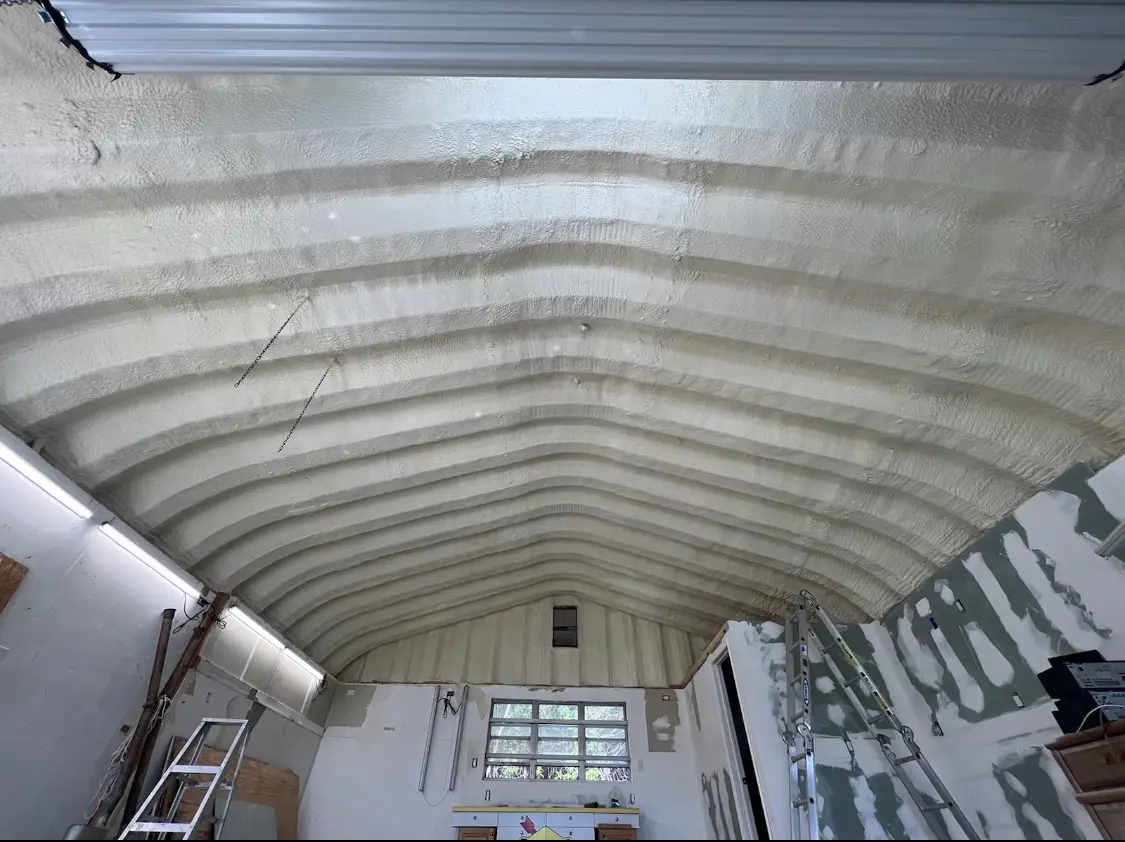 Spray polyurethane foam applied to the underside of a metal roof deck in New Garden